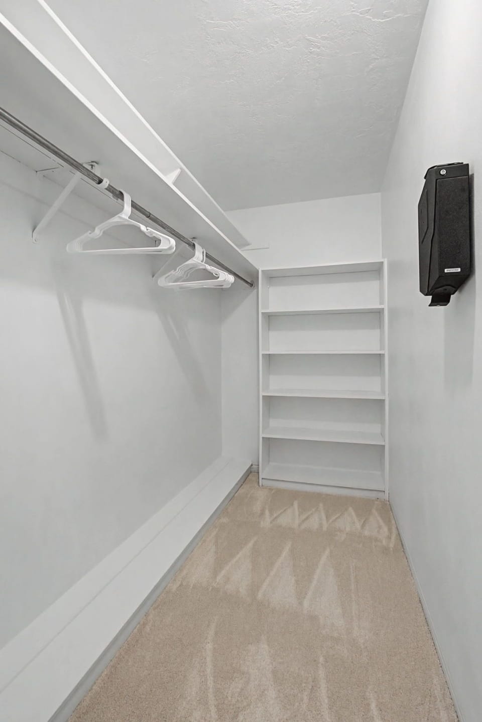 Your spacious walk-in closet offers ample hanging space and custom shelving to keep your belongings perfectly organized during your stay.