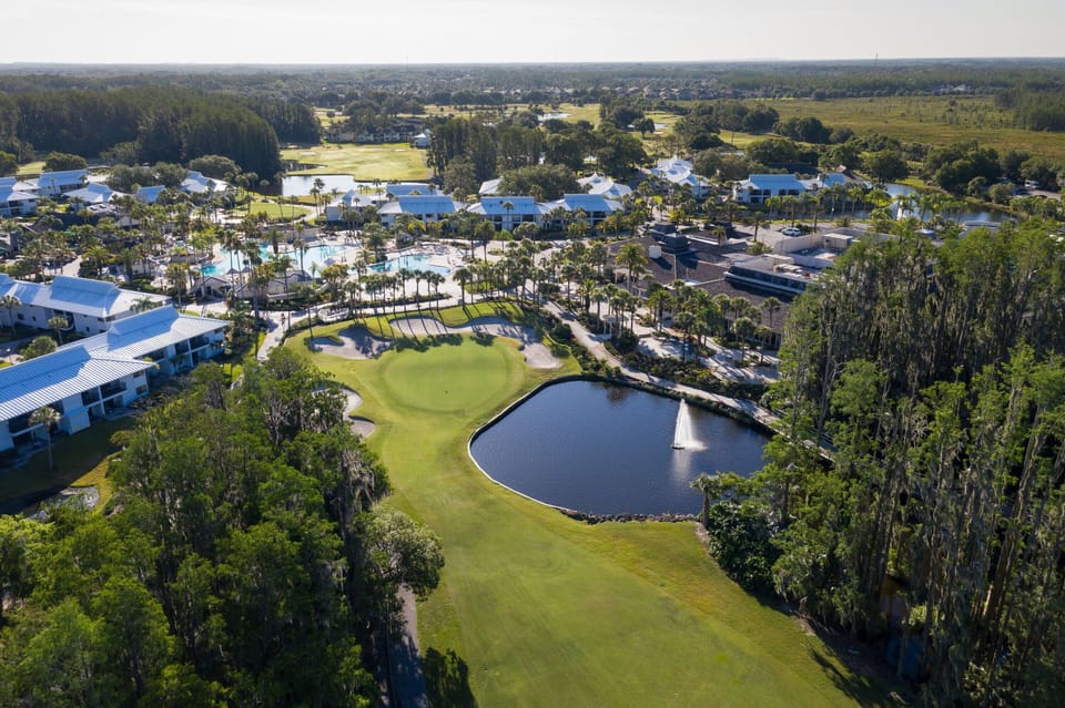 Soak in sweeping aerial views of lakes, greens, and pools.
