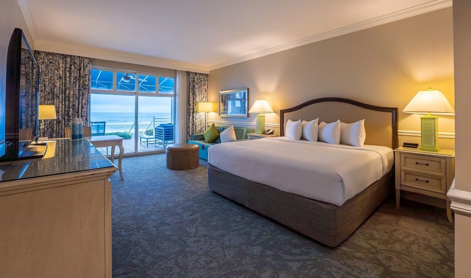 Unwind in a plush king bed with oceanfront glow.