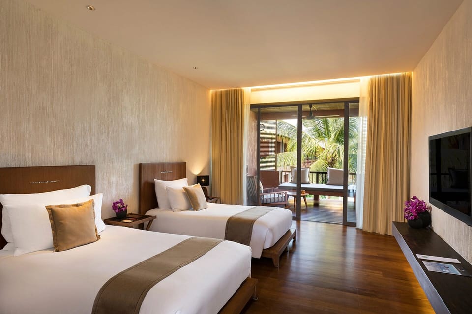 Settle into spacious comfort with terrace views and quiet elegance.