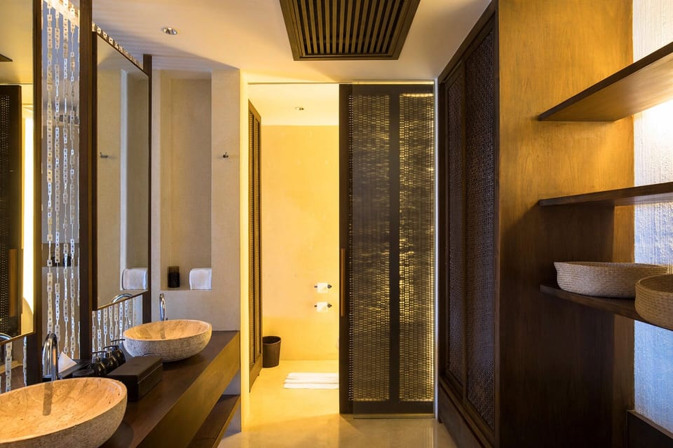 Get ready in style with double basins and soft lighting.