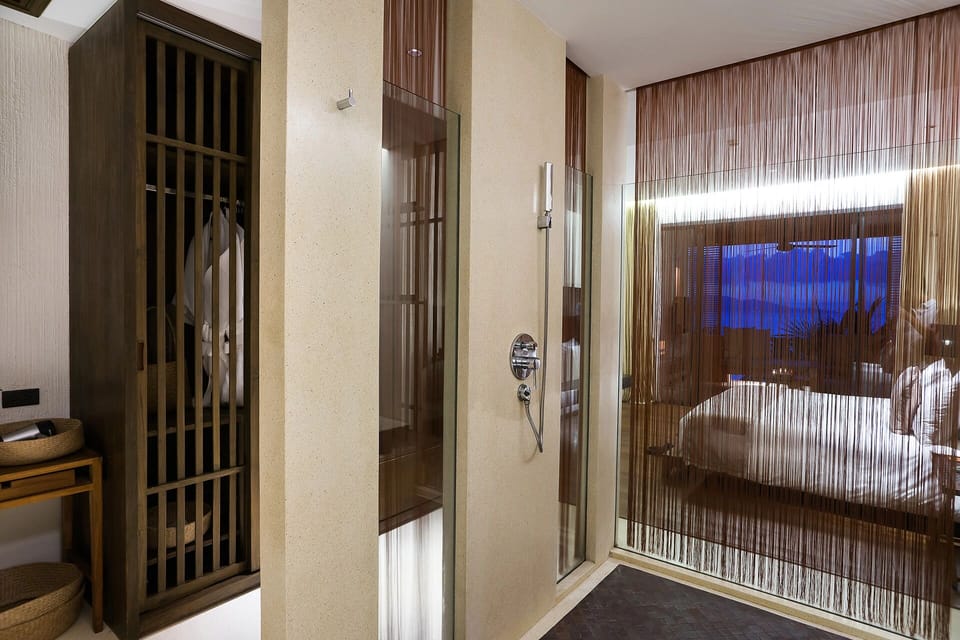 Enjoy a calming rinse in the glass shower beside the suite.