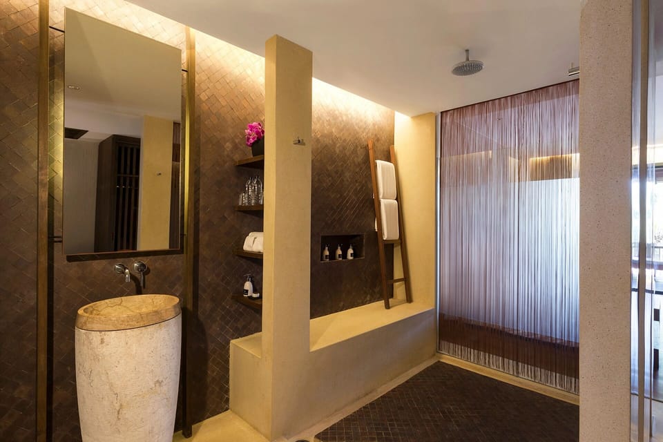 Refresh in a spa-like bathroom with warm, ambient glow.