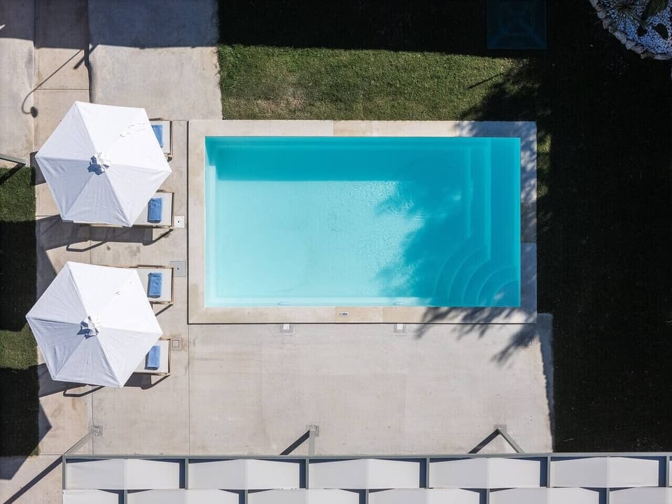Aerial view capturing the pool area within its beautiful surroundings.
