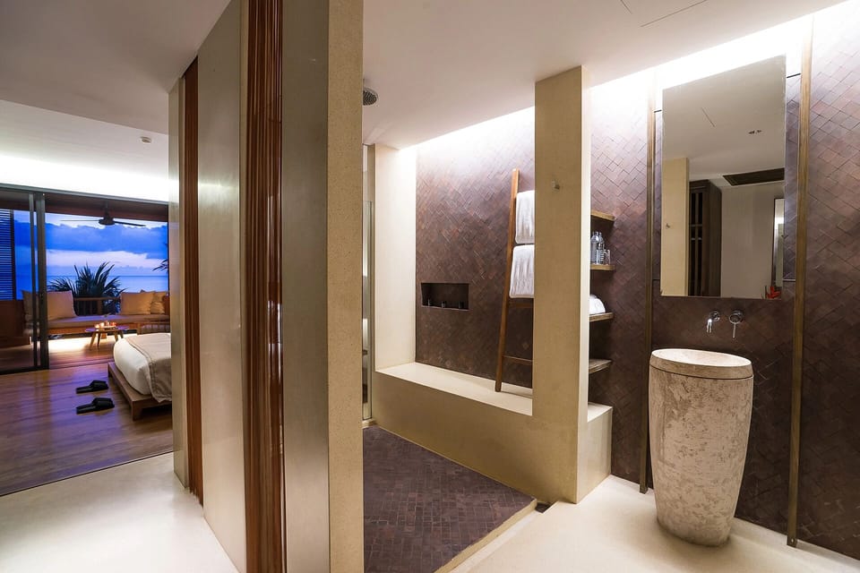 Refresh in a spa-like bathroom with walk-in rainfall shower.