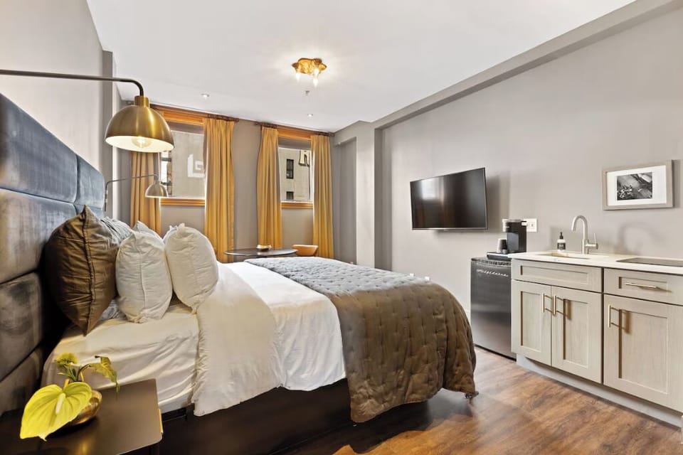 Unwind in a plush bed with convenient in-room essentials.