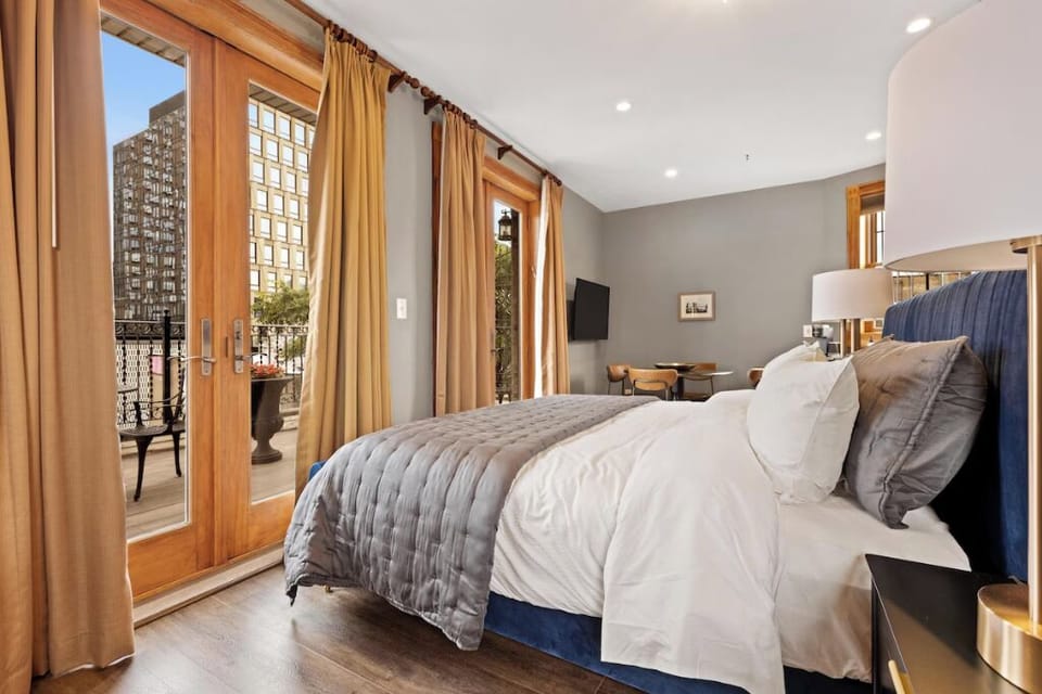 Wake up to sunshine spilling through balcony French doors.