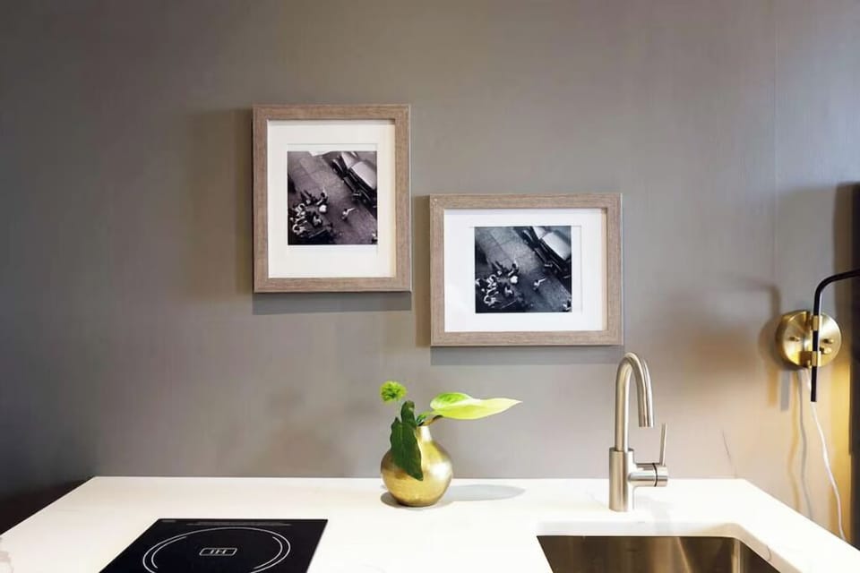 Cook simple meals with sleek cooktop and modern sink.