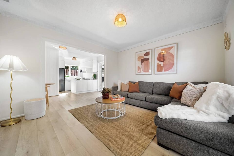 The open-plan living area flows seamlessly into the kitchen, making downtime feel effortless.