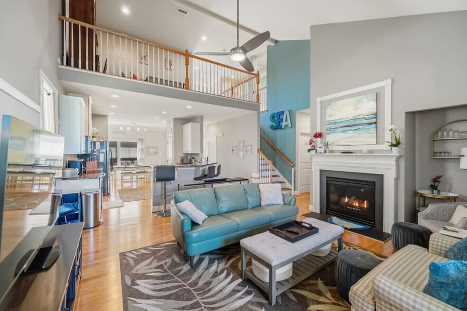 Living Room | Fireplace | Loft View & Blue Leather Sofa