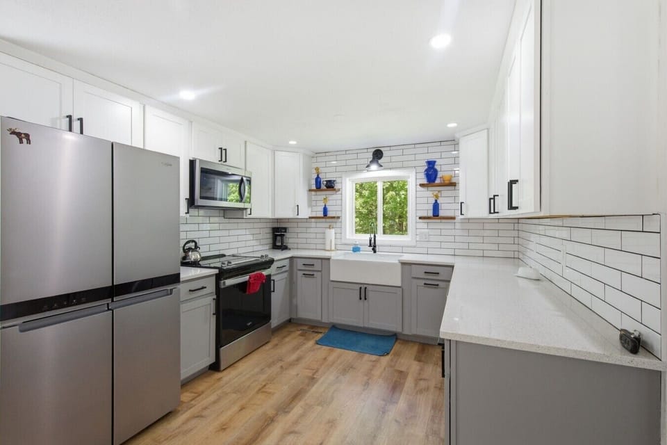 Fully equipped kitchen with modern finishes and plenty of prep space.