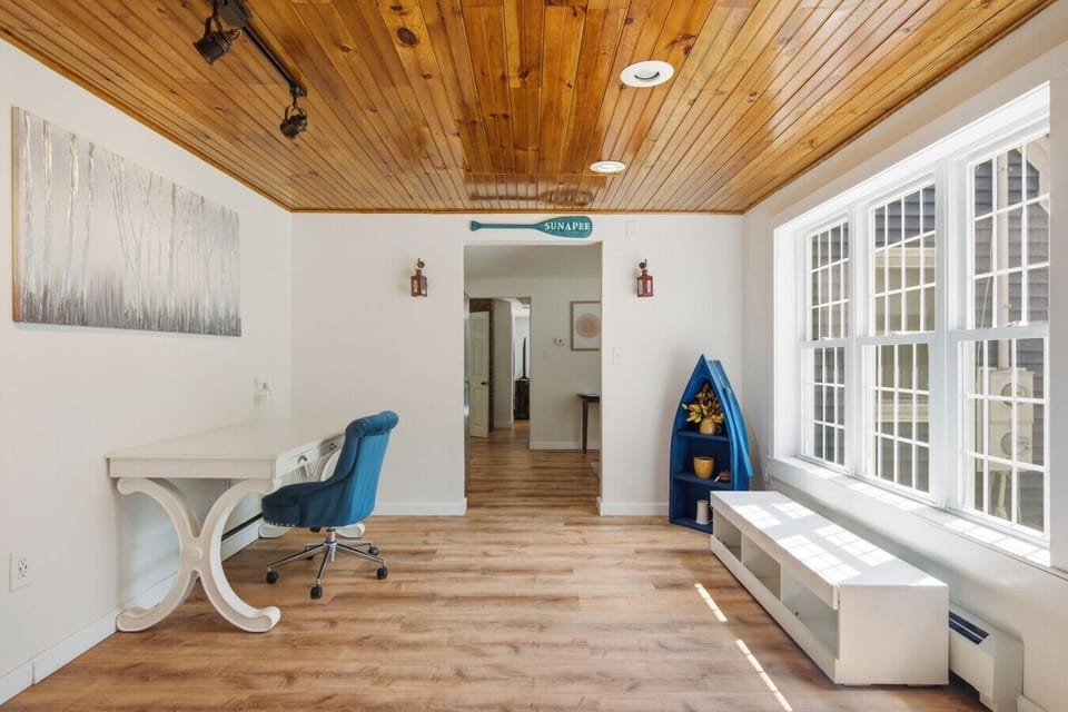 Cozy sitting area filled with natural light and peaceful views.