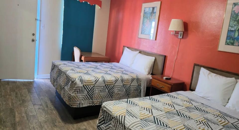 Unwind in bright double beds with crisp linens and cooling AC