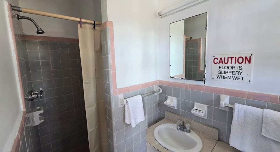 Refresh easily with a clean vanity and bright tiled bath