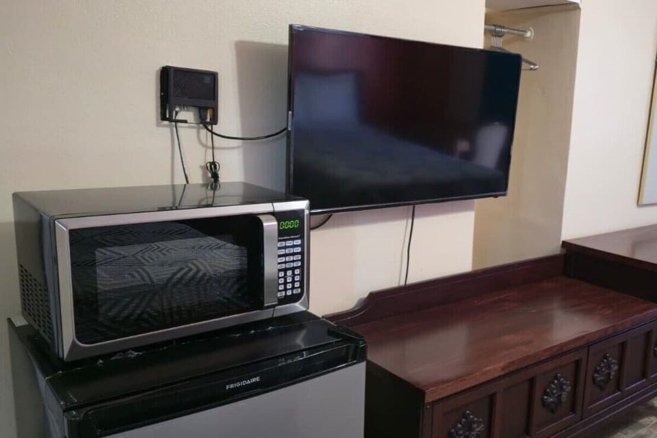 Sip and snack anytime with microwave, mini fridge, and TV nearby
