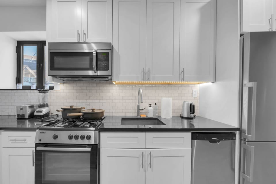 Sleek kitchen with stainless appliances and modern finishes