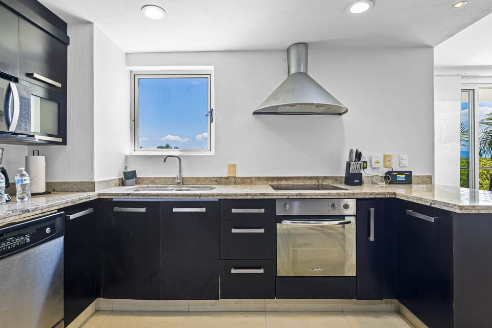 Bright open kitchen connected to the living and dining areas, offering a spacious and functional layout perfect for cooking, entertaining, and relaxing.