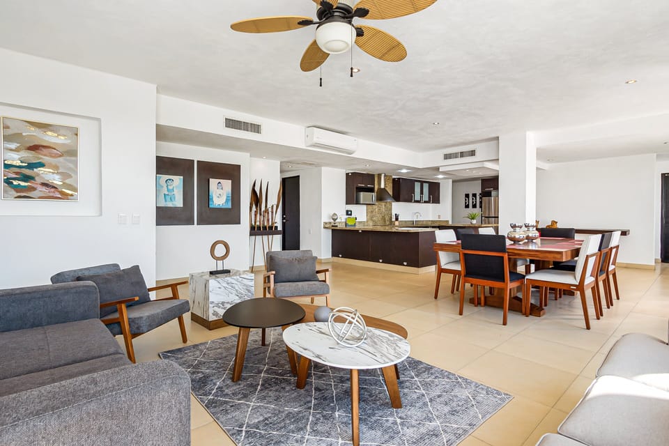 Relax in the cozy living area, gather around the dining table, or cook with ease in the fully equipped kitchen featuring modern finishes.