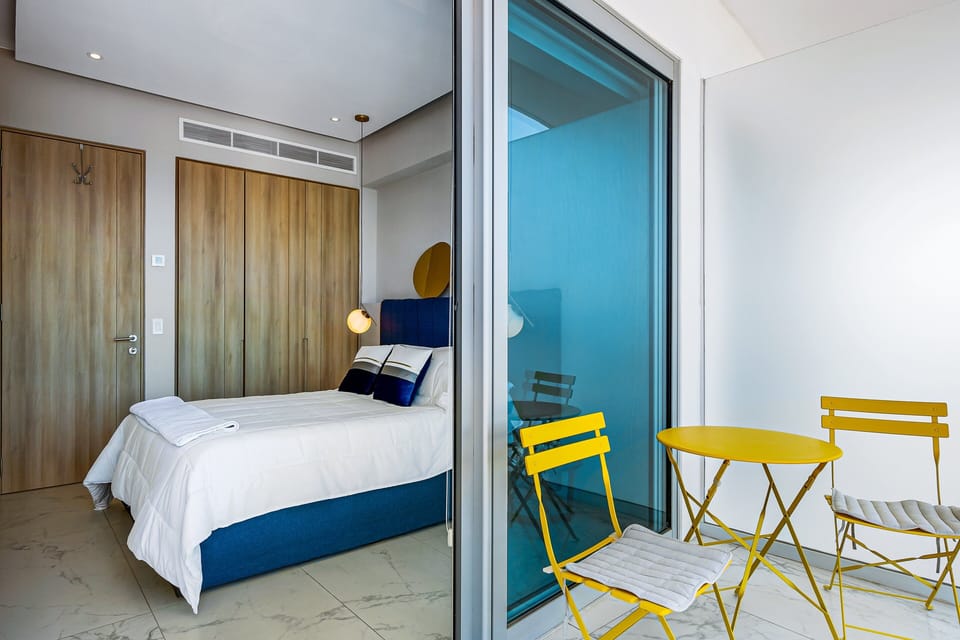 Enjoy direct access to the balcony from this bright bedroom, where natural light and beautiful views create a relaxing escape.