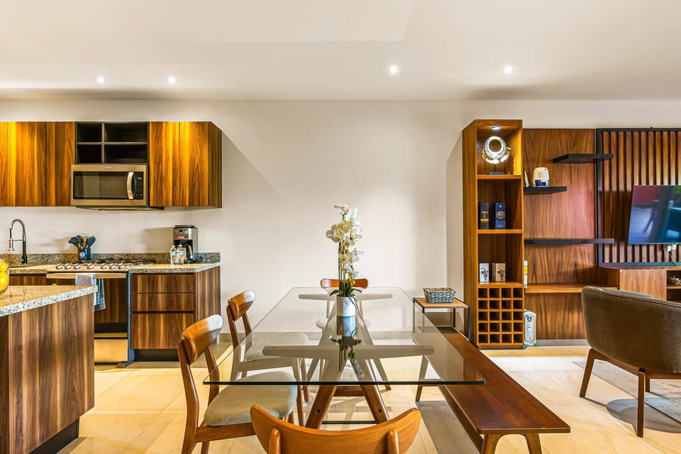 Share meals and conversation in the welcoming dining area connected seamlessly to the fully equipped kitchen and living space.