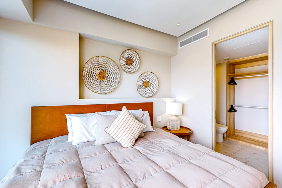 Rest comfortably in a bright, inviting bedroom with plush bedding, elegant décor, and peaceful views to start each day refreshed.