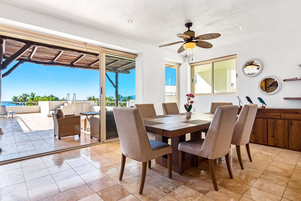Enjoy open-air dining on the spacious rooftop terrace with ocean breezes, shaded seating, and beautiful tropical views.