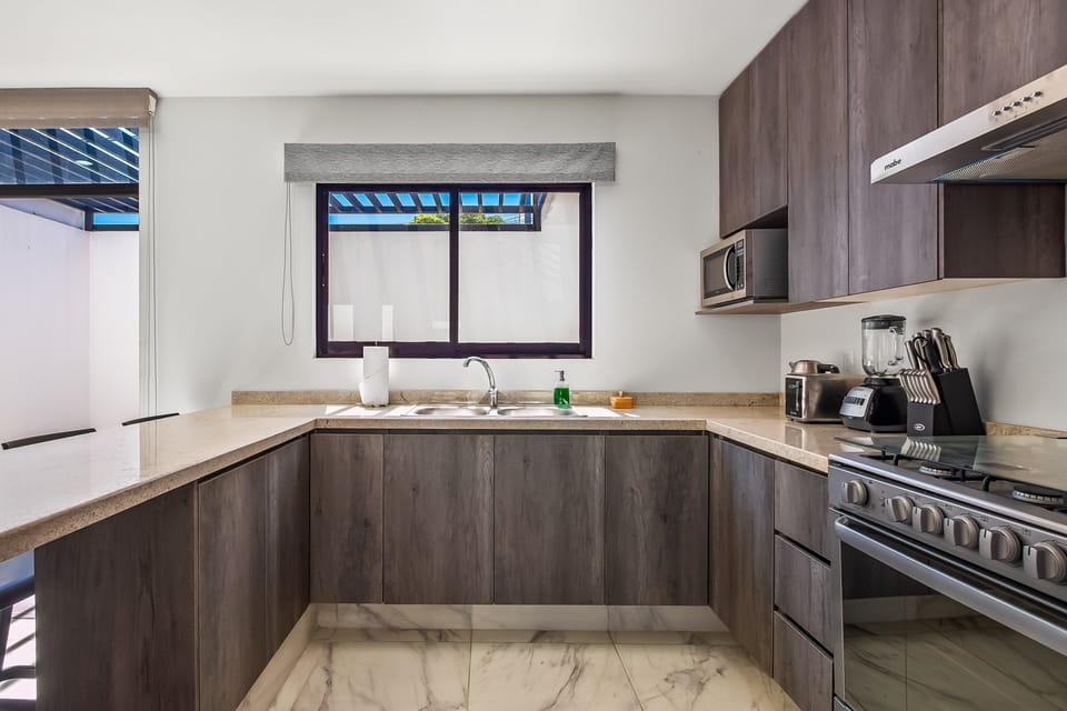 This well-appointed kitchen offers quality appliances, generous counter space, and everything needed for an effortless stay.
