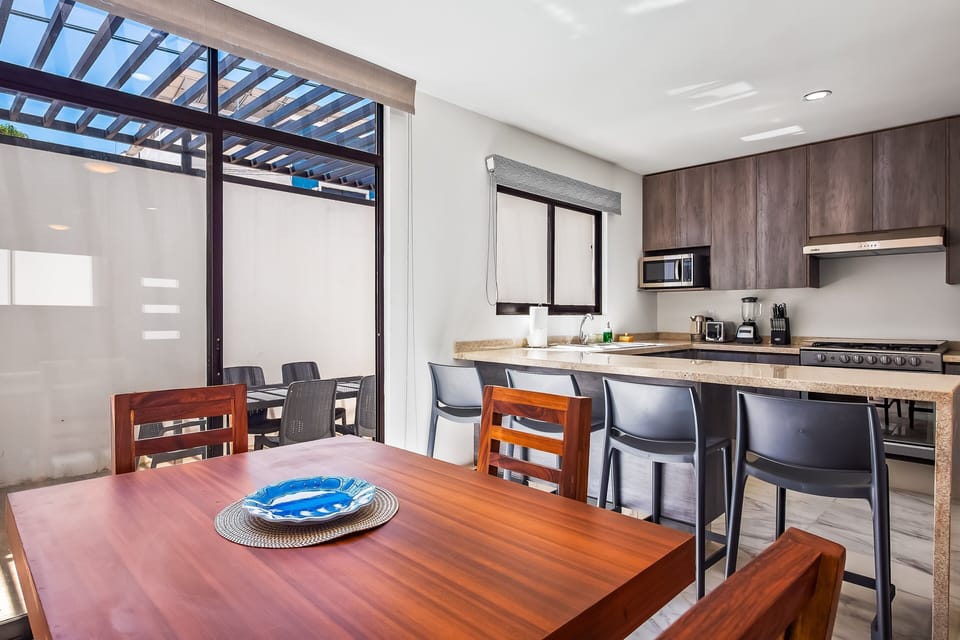 Enjoy a bright and functional layout that combines a modern kitchen with a comfortable dining area for shared meals.