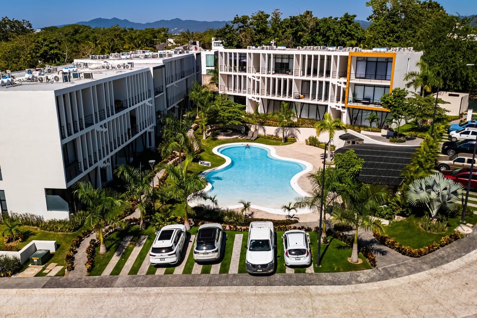 Enjoy a tropical escape at this stylish resort featuring a sparkling pool, lush landscaped gardens, convenient on-site parking, and a peaceful atmosphere—just moments from the beach and local attractions.