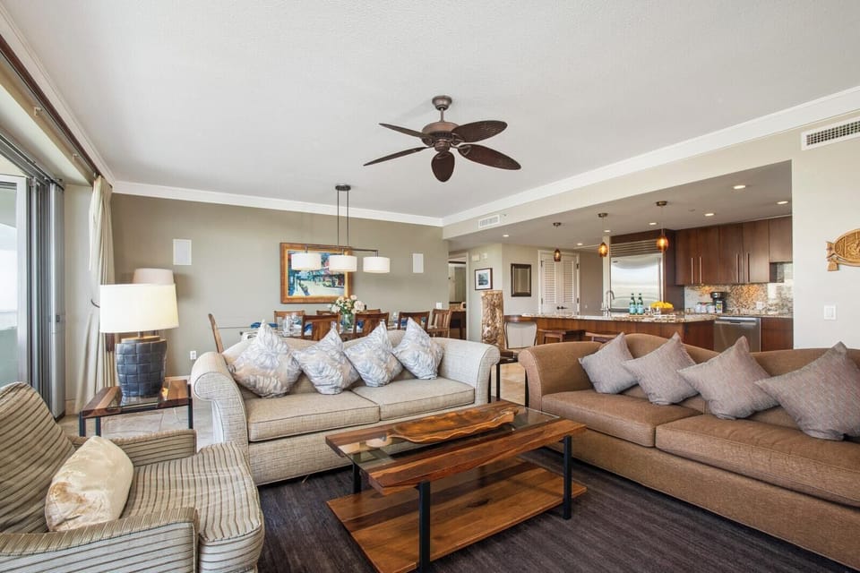 Spacious oceanview suite with modern kitchen and cozy seating HKH-503