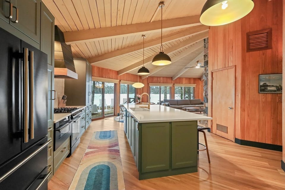 Spacious kitchen with bar seating for four.