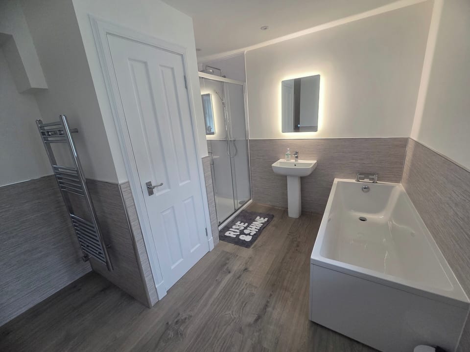 Bathroom with walk in shower, bath, toilet & sink