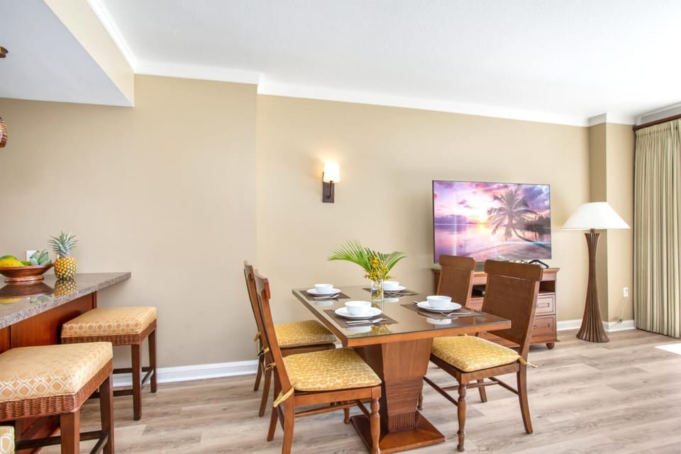 Tropical dining setting with warm tones, island fruit, and ambiance. HKK-229
