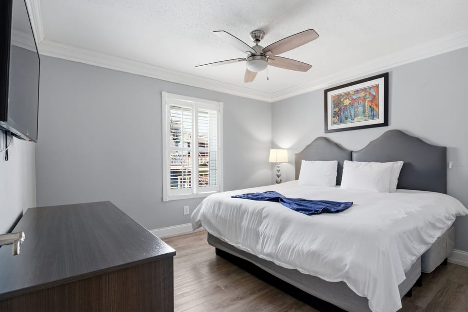 Unit 207 secondary king bedroom w/ calming tones & a bright, airy feel.
