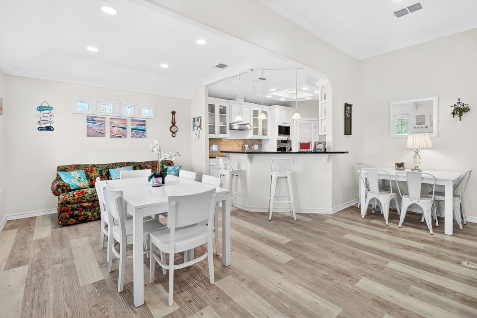 Relax in your bright, open living space where the kitchen flows seamlessly into cozy dining areas, creating the perfect gathering spot for memorable meals.