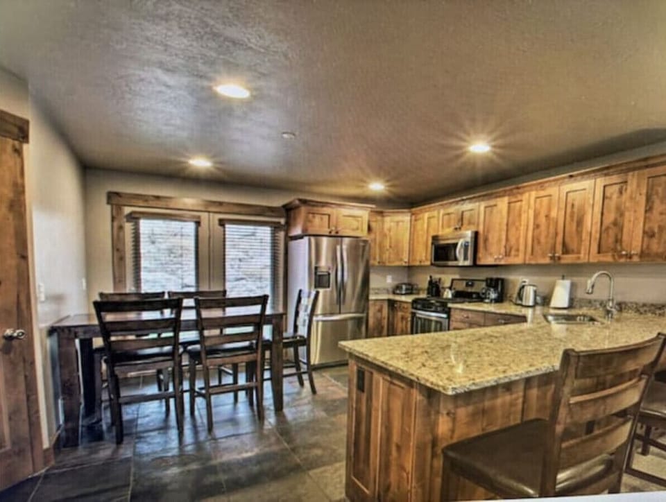 Kitchen | Stainless Steel Appliances | Island Seating & Dining Area