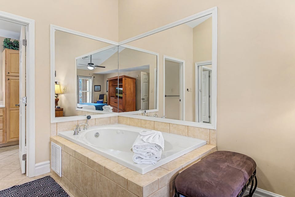 Unwind in your own luxurious soaking tub, complete with soft towels and a romantic view into the bedroom.