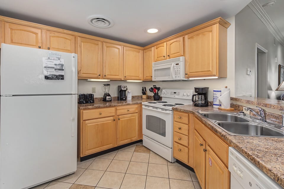 Your fully equipped kitchen awaits with granite counters, modern appliances, and everything needed for home-cooked meals during your stay.