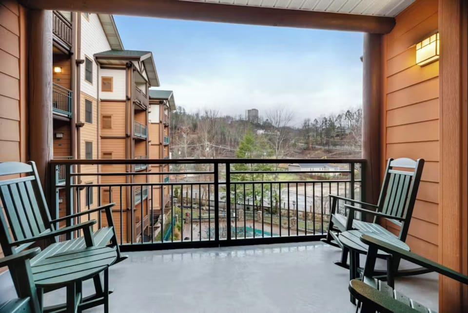 Unwind on your private covered balcony with comfortable seating while taking in peaceful views of the surrounding landscape.