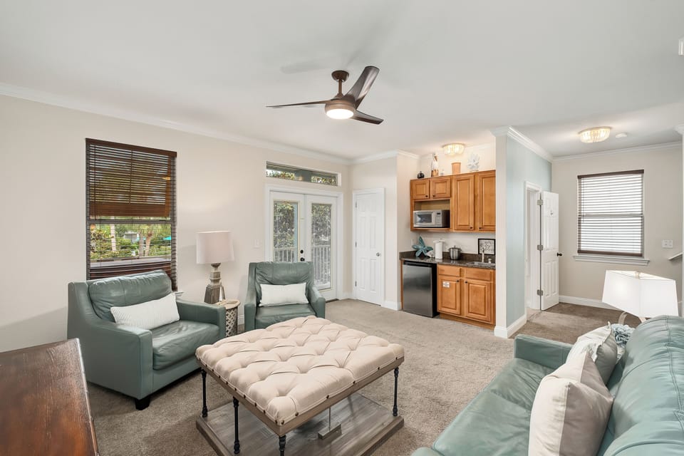 Relax in your bright, airy living space with plush seating, a ceiling fan to keep you cool, and your own convenient kitchenette for easy meal prep—perfect for unwinding after a day of adventure.