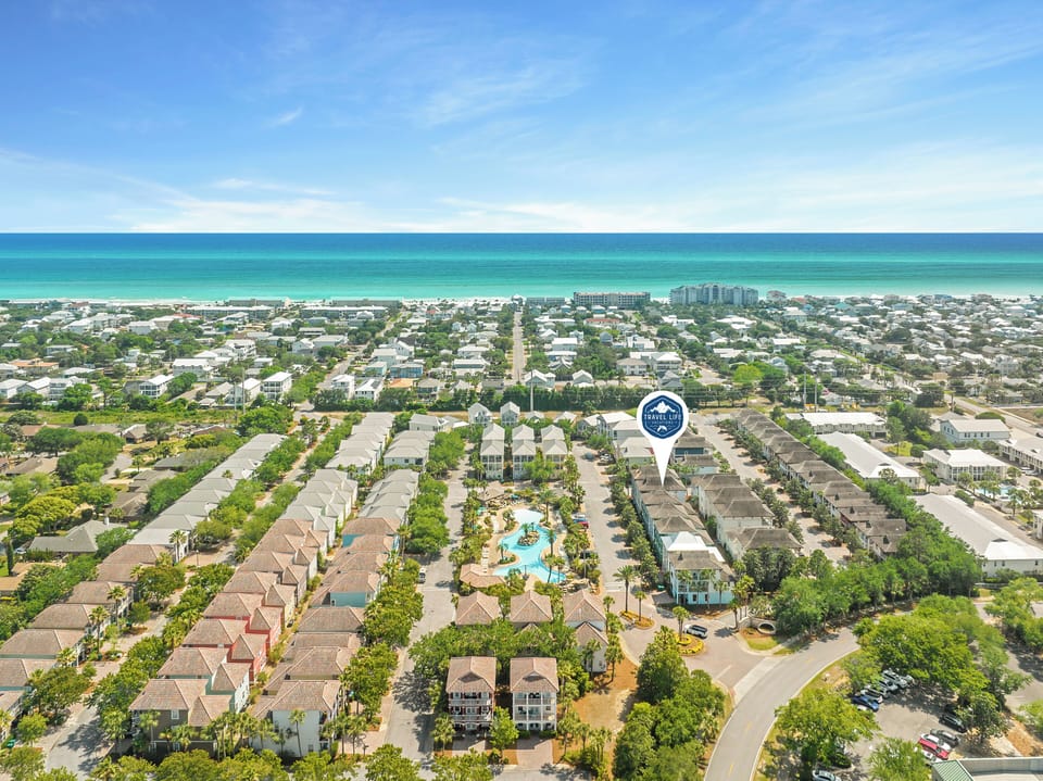 Aerial view of the property nestled in a coastal community, just a short distance from pristine turquoise waters and sandy beaches.