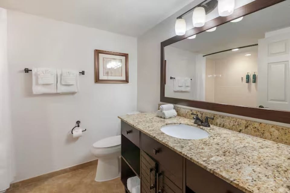 Refresh in a bright bath with spacious granite vanity.