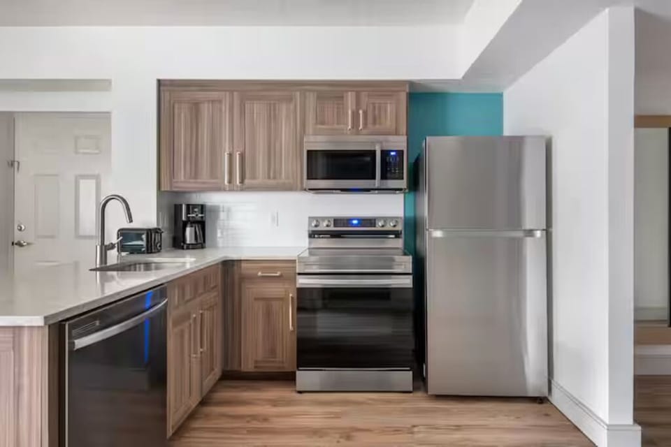 Cook with ease in a modern kitchen with full appliances.