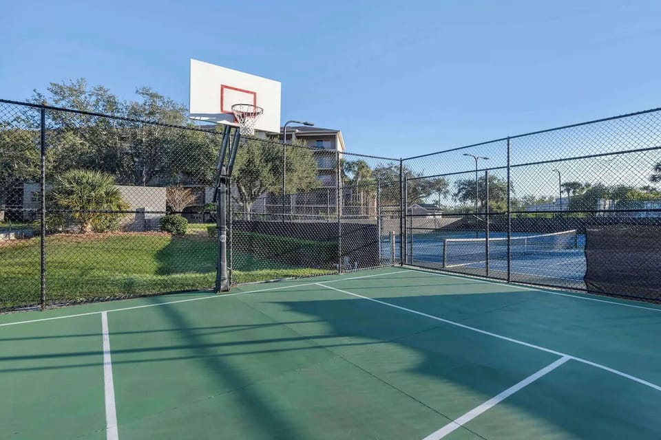 Shoot hoops anytime on the fenced multi-sport court.