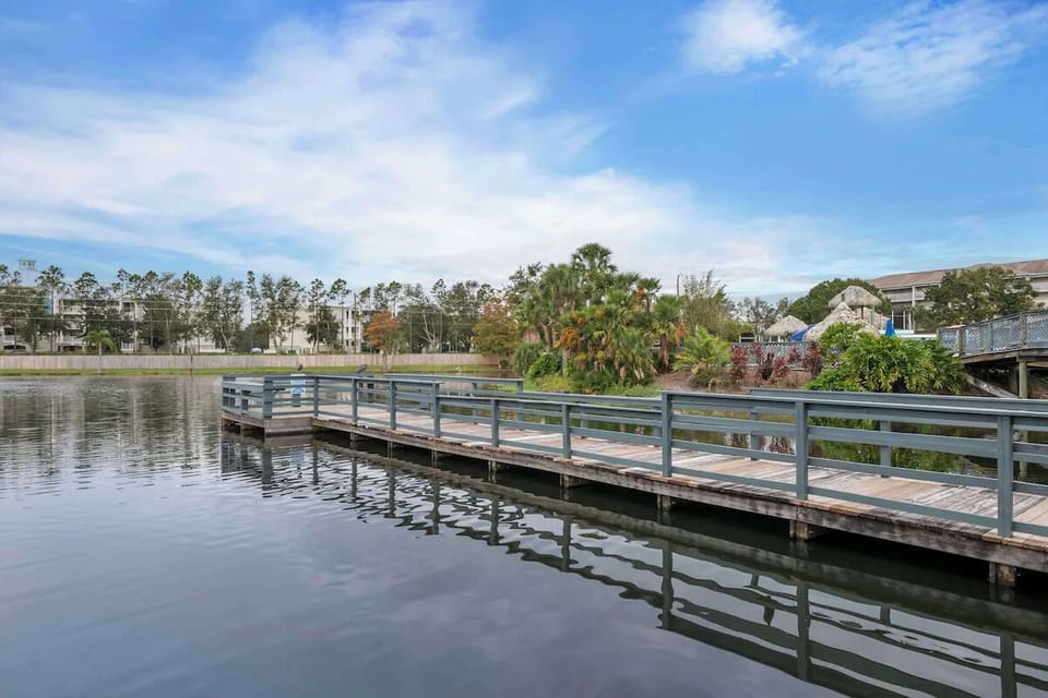 Stroll along the tranquil boardwalk as the lake shimmers.