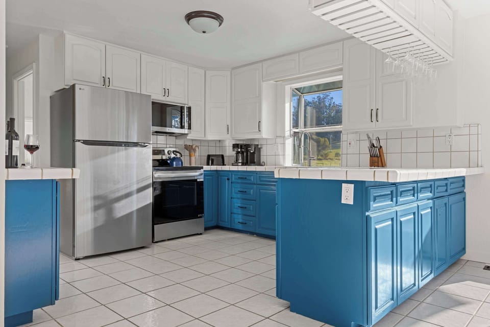 Modern kitchen update with sleek new appliances and an induction stove—perfect for cooking up local finds from the Sonoma markets.