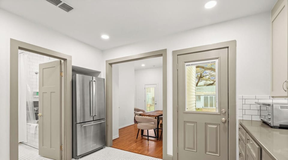 A bright, functional space with easy access to the kitchen, dining area, and full bathroom.