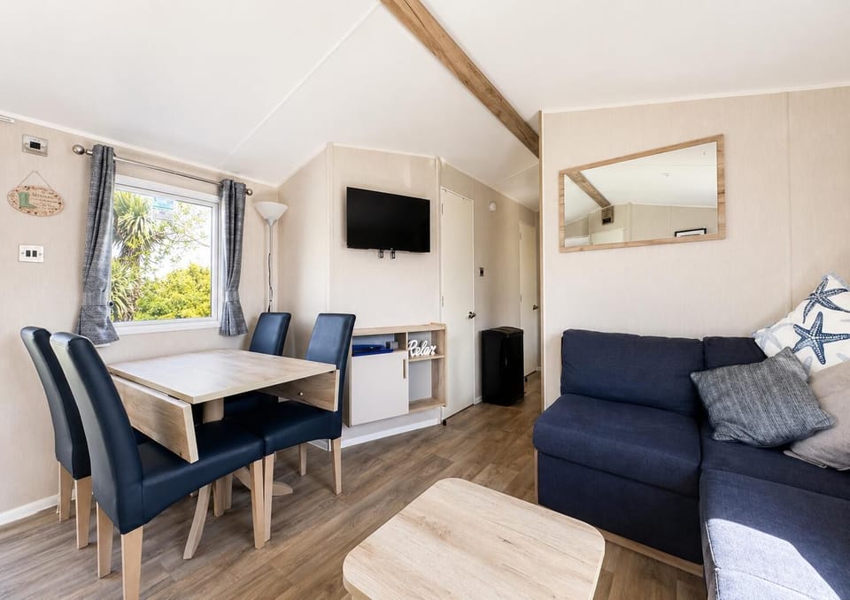 The dining table seats 4 comfortably and is the perfect place to enjoy a meal together with the family. Once dinner is served and eaten grab the board games for a fun filled games night in your caravan.