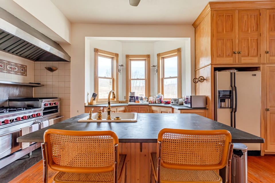 Open kitchen with island seating - perfect for hosting and casual dining