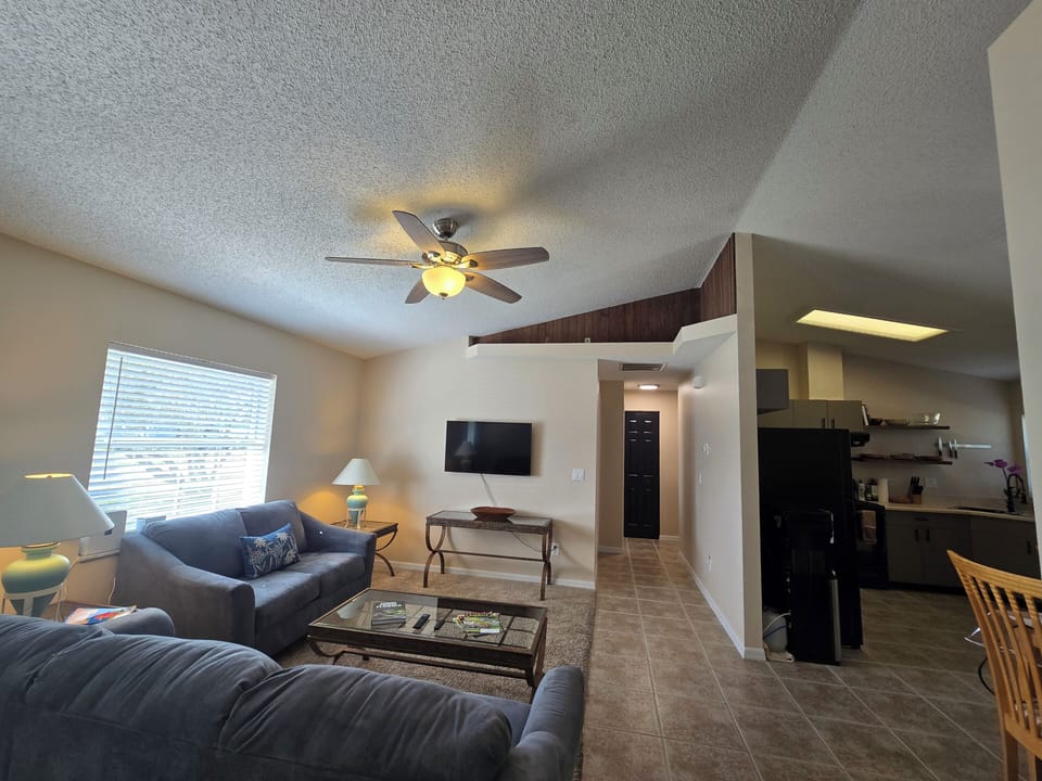 The Living room, hallway to 2 bed rooms, another full bath and the Kitchen.